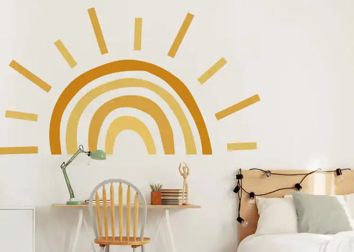 Golden sun-shaped rainbow wall decal with radiating rays.